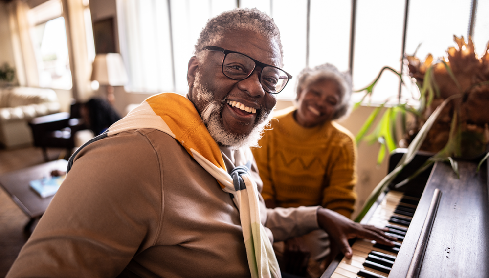 Senior man playing piano — mental engagement supports brain health and body coordination